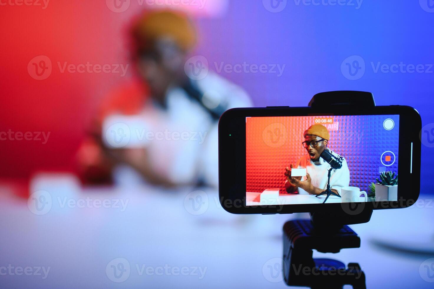 Black male influencer creates material for his internet audience, discussing new trends photo
