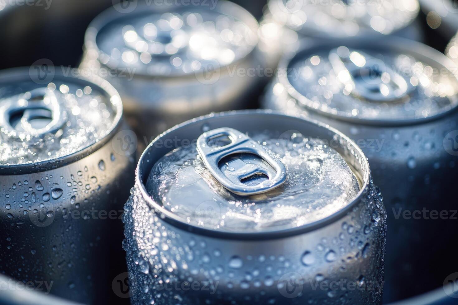 Refreshing cold cans of soda nestled in ice during a summer gathering photo