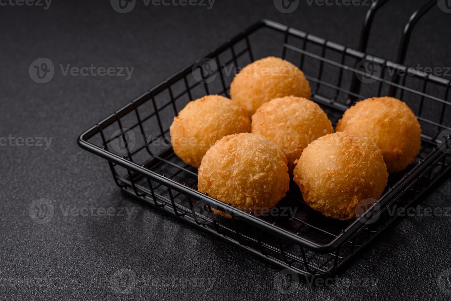 Fast food cheese balls breaded with salt and spices photo
