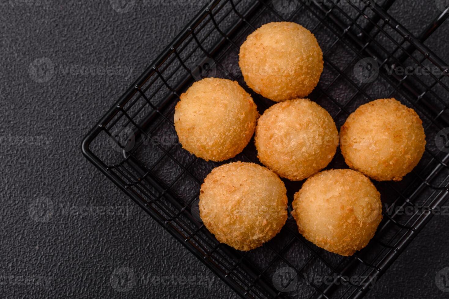 Fast food cheese balls breaded with salt and spices photo