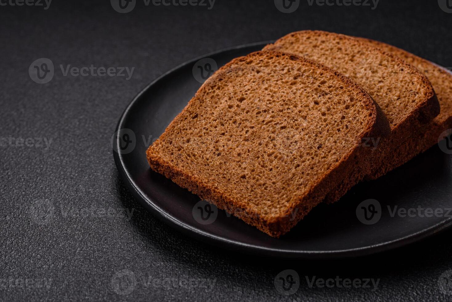 Fresh crispy brown bread sliced from whole grain flour photo
