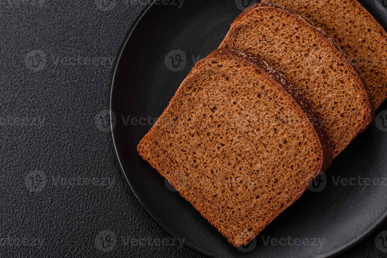 Fresh crispy brown bread sliced from whole grain flour photo