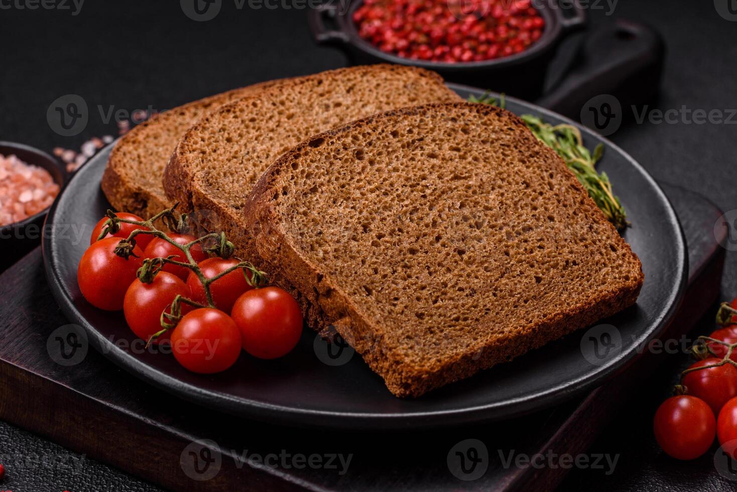 Fresh crispy brown bread sliced from whole grain flour photo