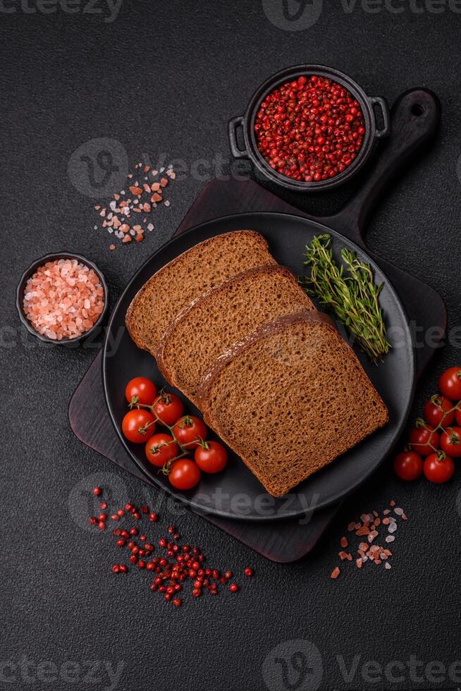 Fresh crispy brown bread sliced from whole grain flour photo