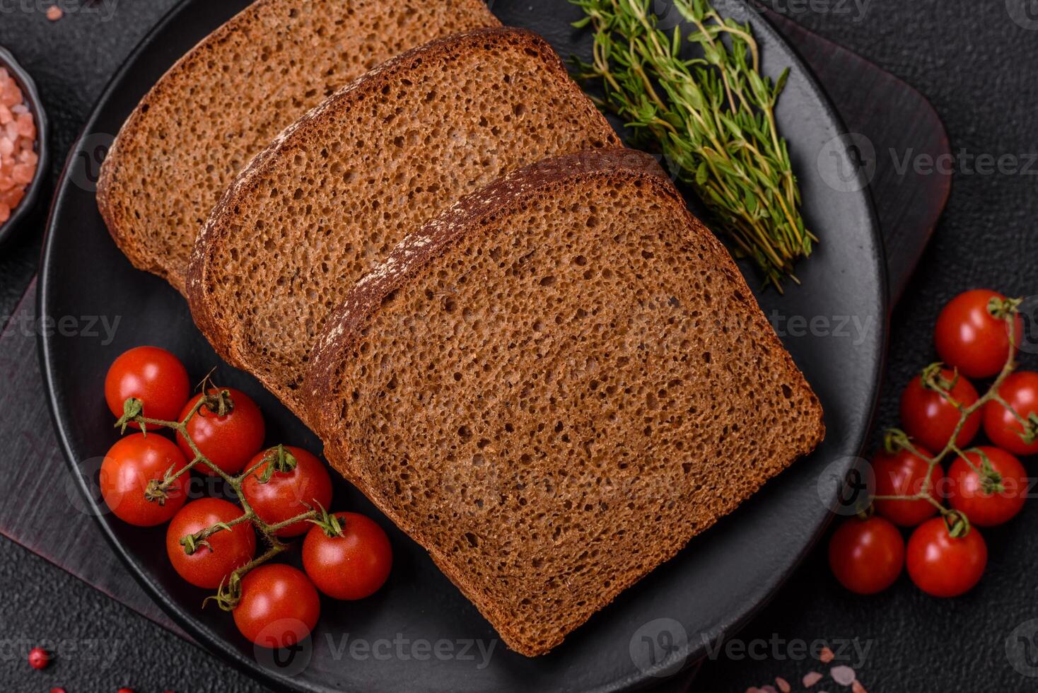 Fresh crispy brown bread sliced from whole grain flour photo
