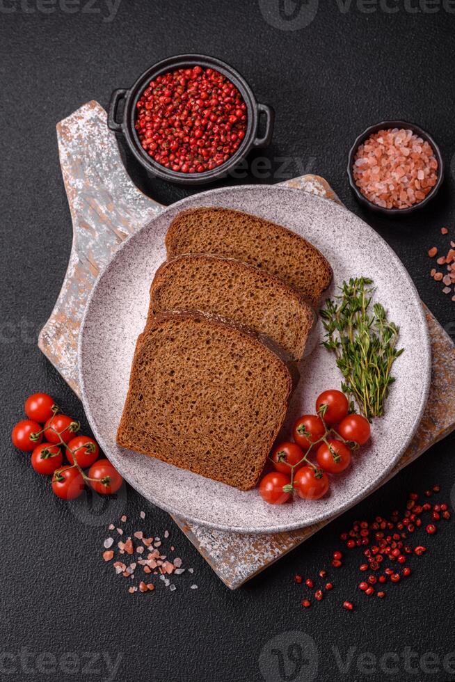 Fresh crispy brown bread sliced from whole grain flour photo