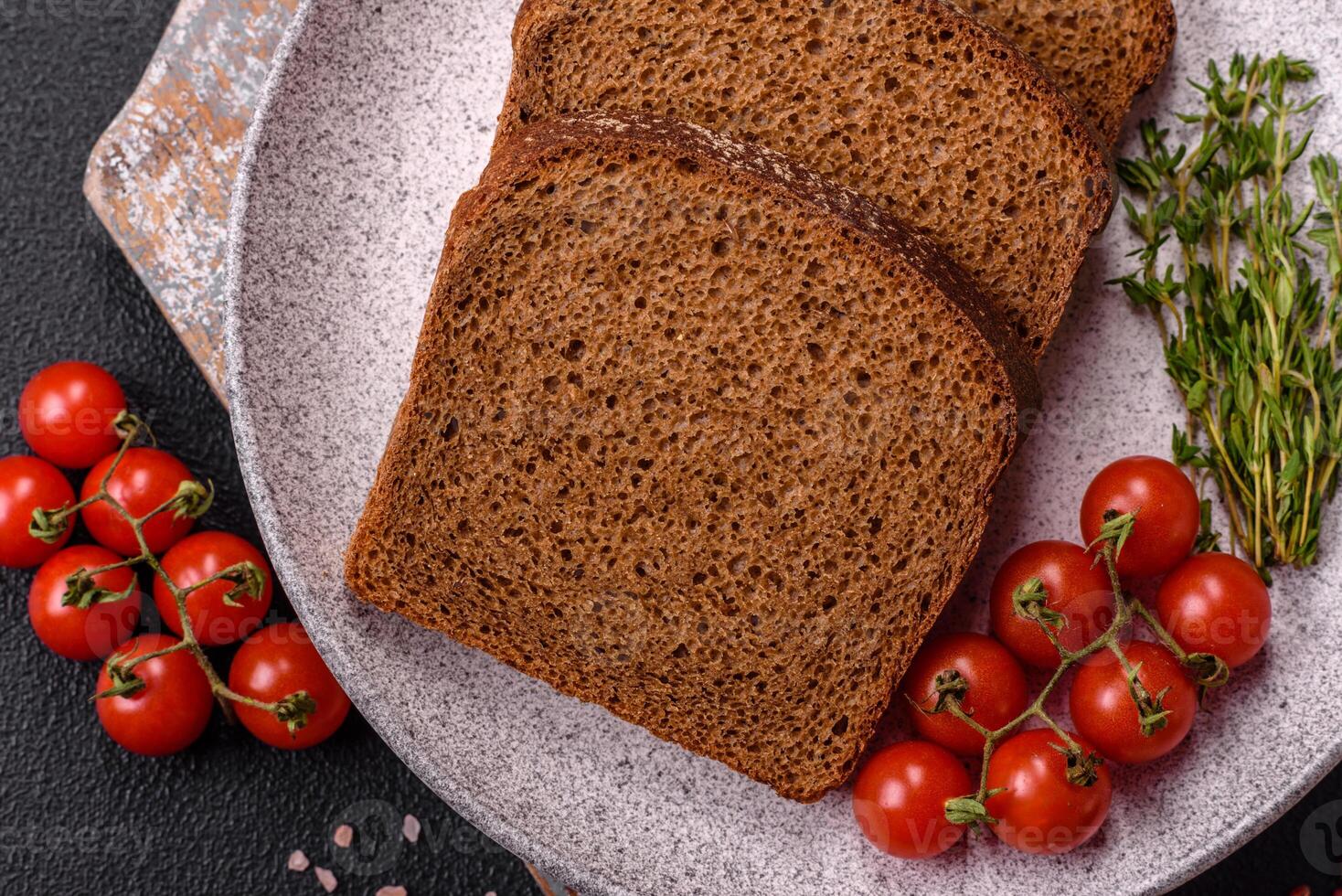 Fresh crispy brown bread sliced from whole grain flour photo