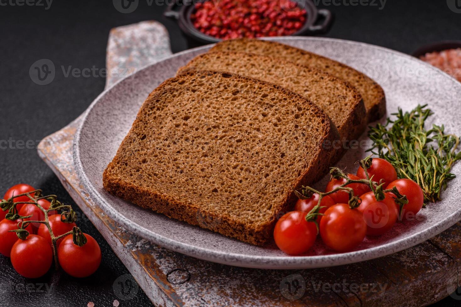 Fresh crispy brown bread sliced from whole grain flour photo