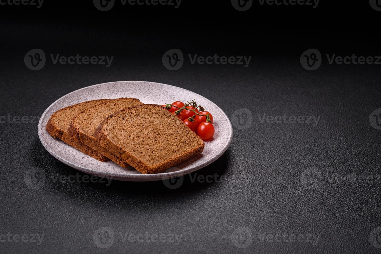 Fresh crispy brown bread sliced from whole grain flour photo