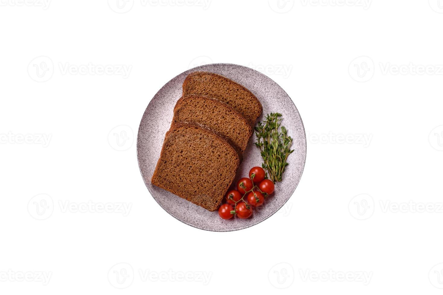 Fresh crispy brown bread sliced from whole grain flour photo