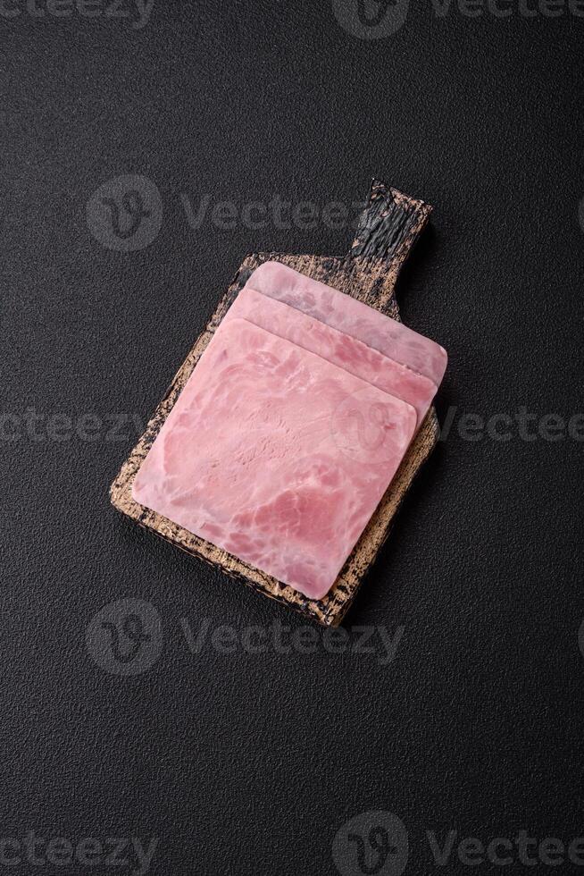 Ham cut into square slices for making delicious nutritious sandwiches photo