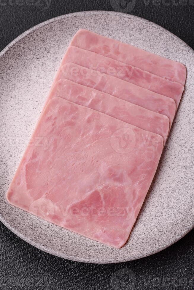 Ham cut into square slices for making delicious nutritious sandwiches photo