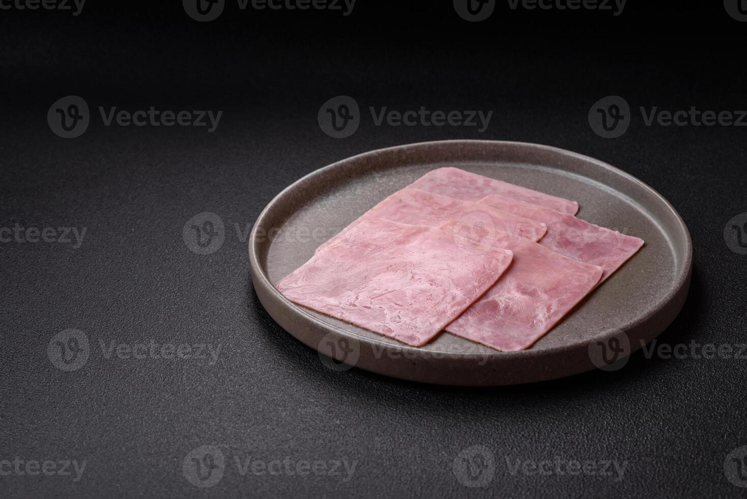 Ham cut into square slices for making delicious nutritious sandwiches photo