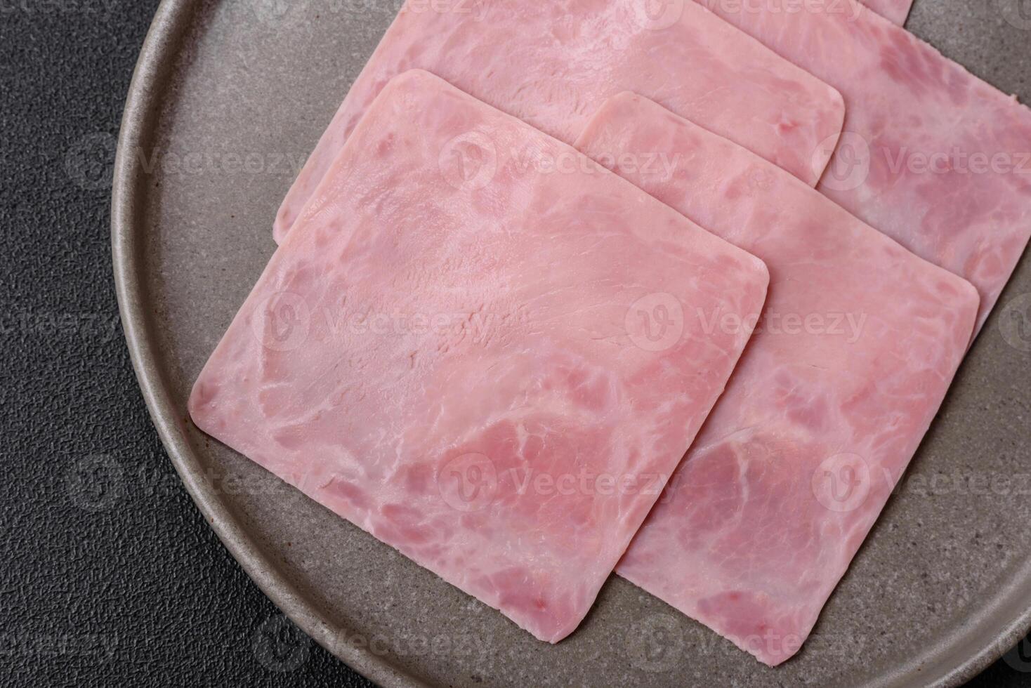 Ham cut into square slices for making delicious nutritious sandwiches photo