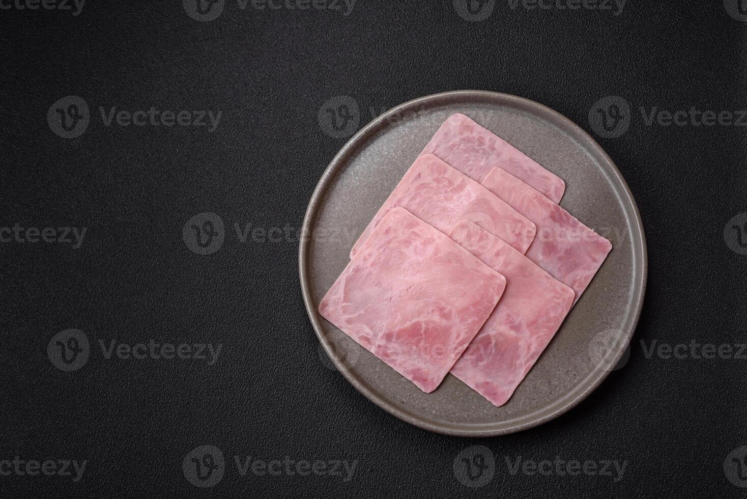 Ham cut into square slices for making delicious nutritious sandwiches photo