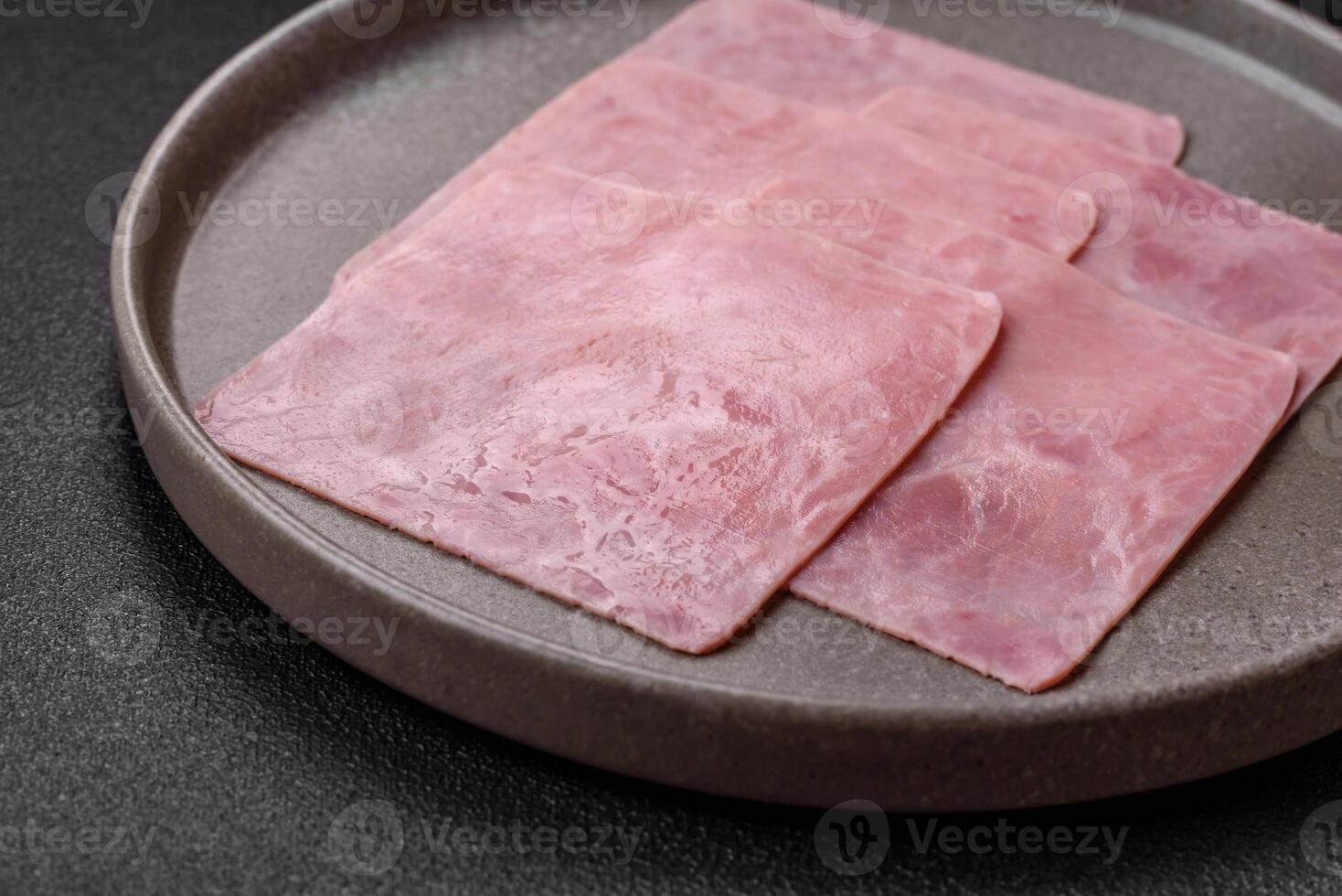 Ham cut into square slices for making delicious nutritious sandwiches photo