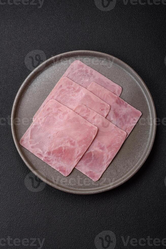 Ham cut into square slices for making delicious nutritious sandwiches photo