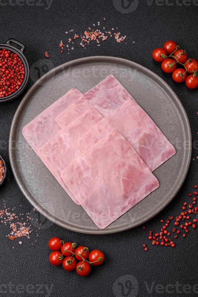 Ham cut into square slices for making delicious nutritious sandwiches photo