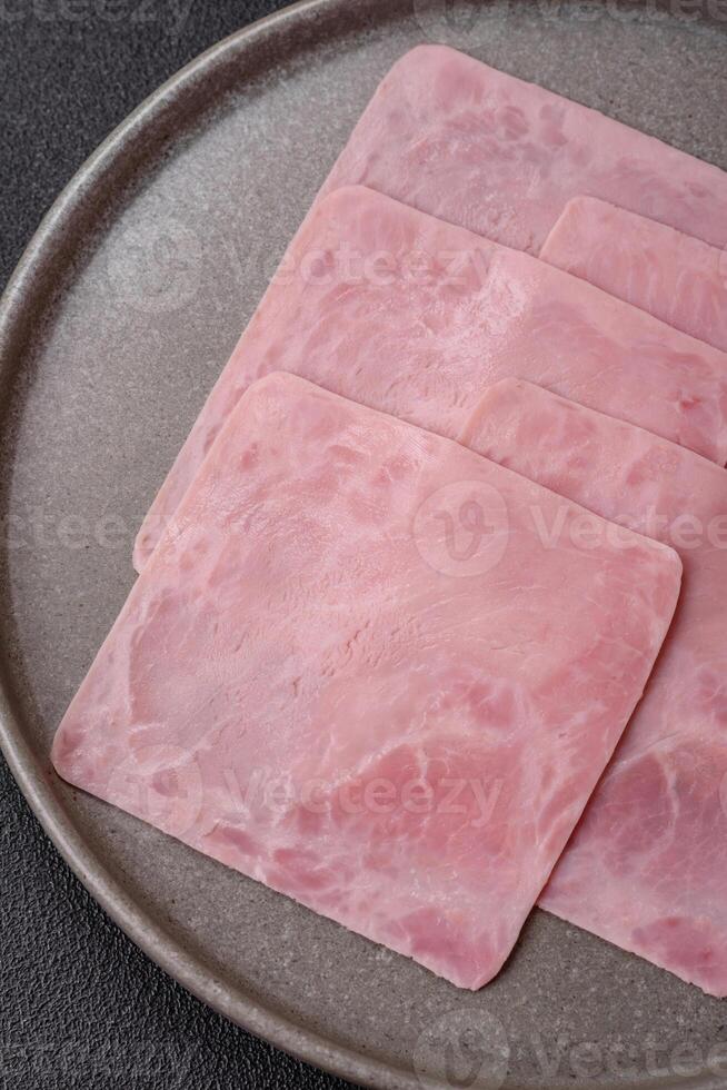 Ham cut into square slices for making delicious nutritious sandwiches photo
