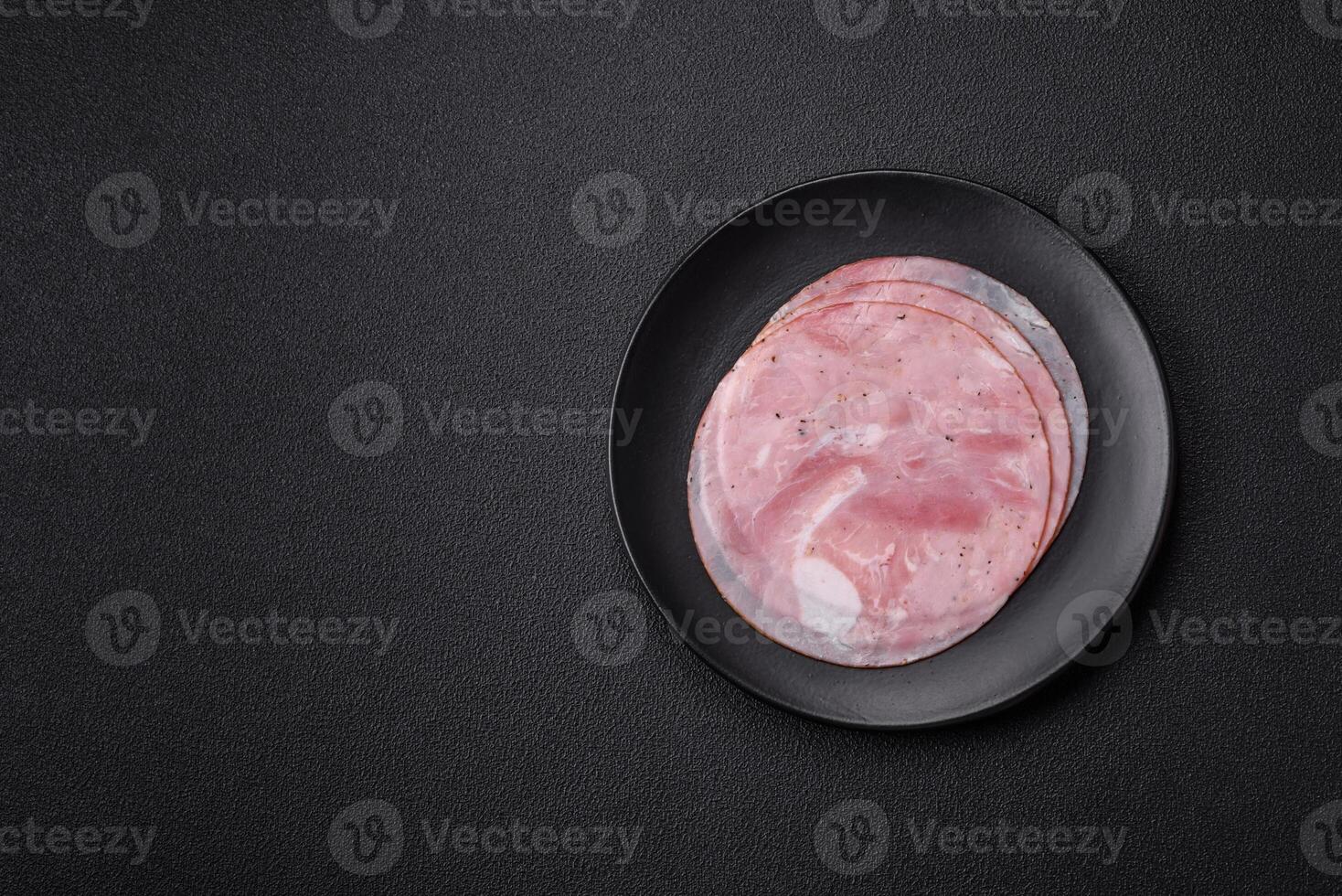 Ham cut into round slices with salt, spices and herbs photo