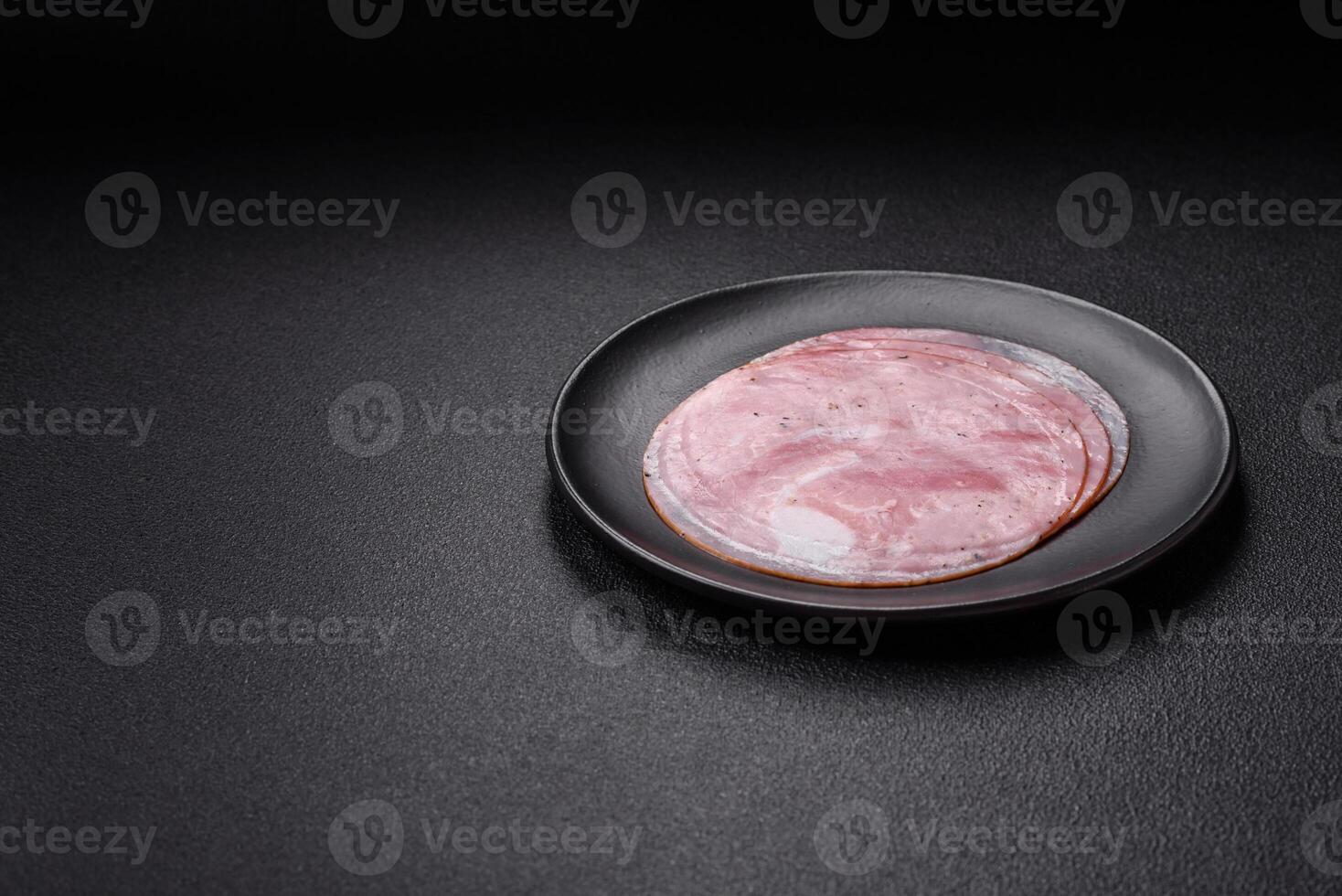 Ham cut into round slices with salt, spices and herbs photo