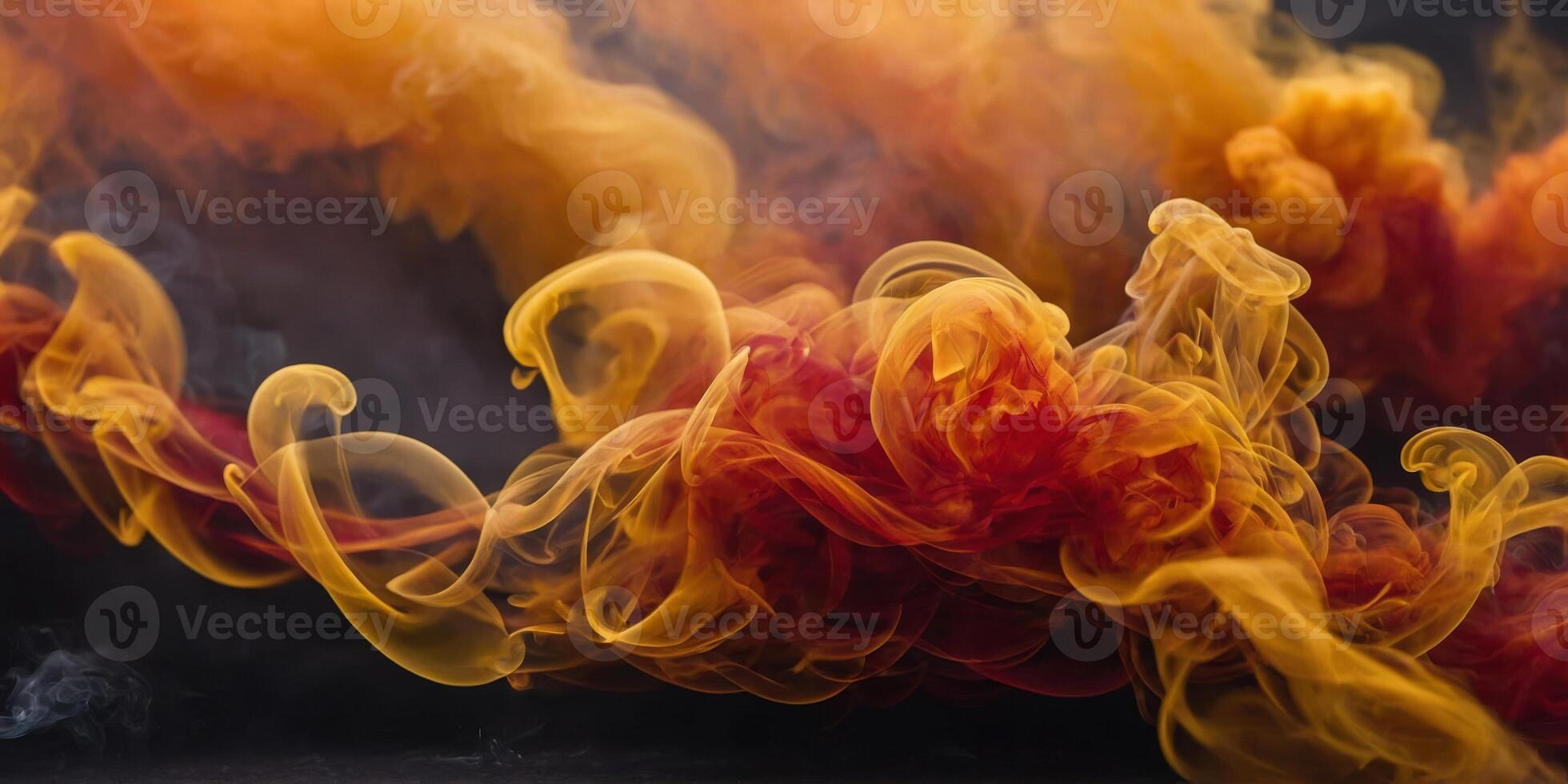 Fiery red orange and yellow smokes intertwine and blend together in a fiery and dramatic display. photo