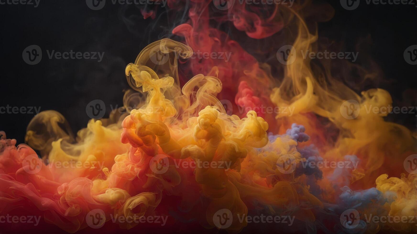 Fiery reds oranges and yellows blend together in this stunning display of colorful smoke. photo