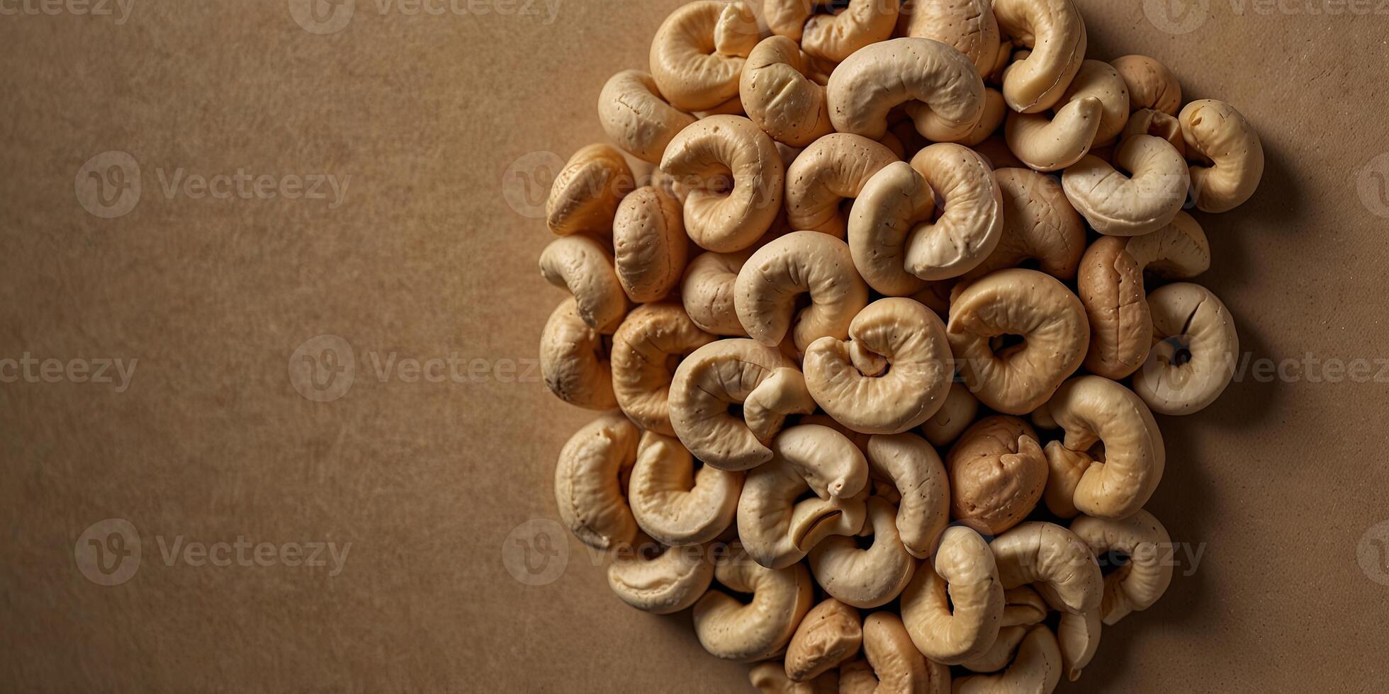 Cashew nuts on a beige background, top view Healthy snack and food concept. photo