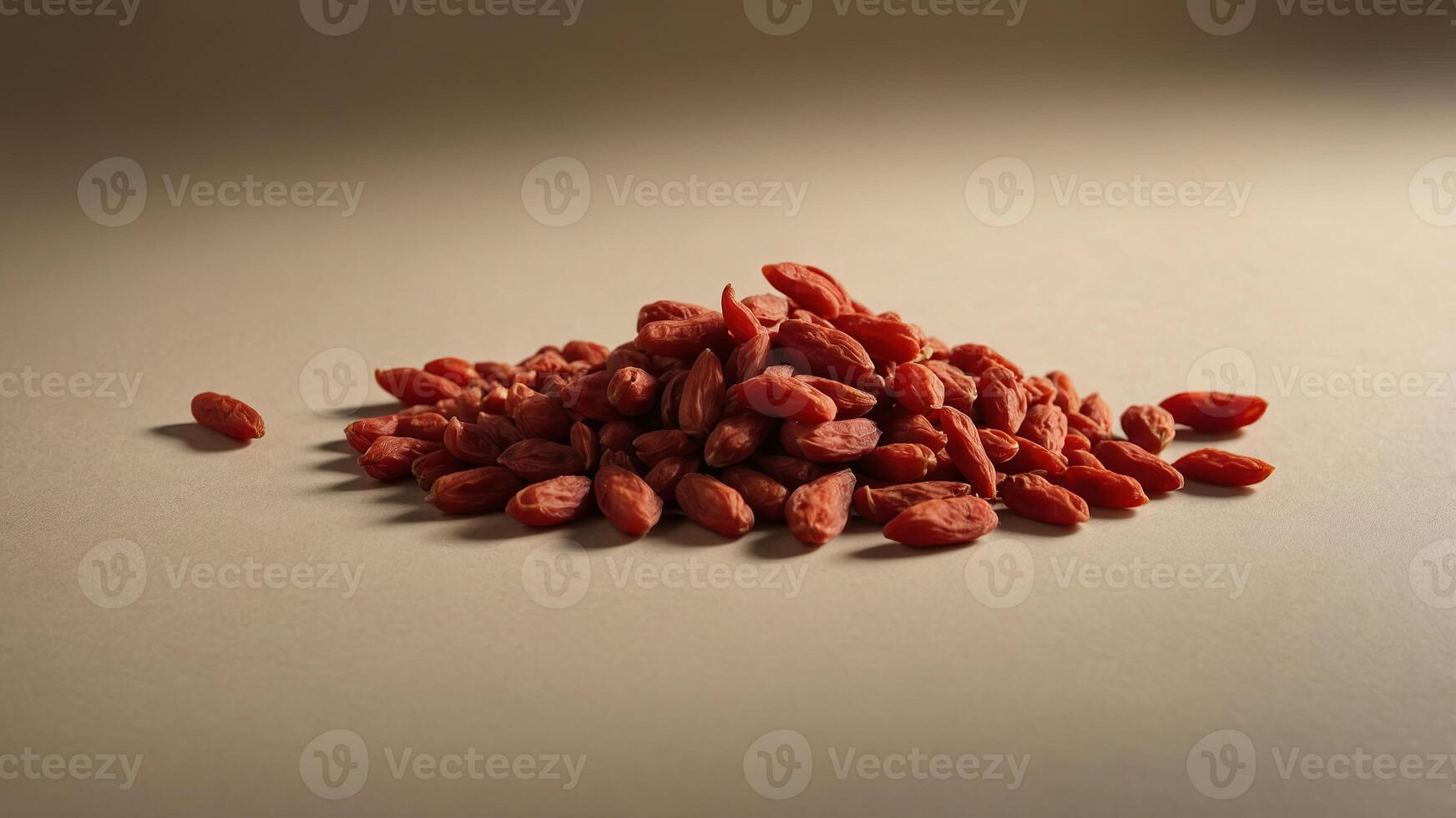 Dried goji berries on beige background with shadows, minimalistic food concept. photo