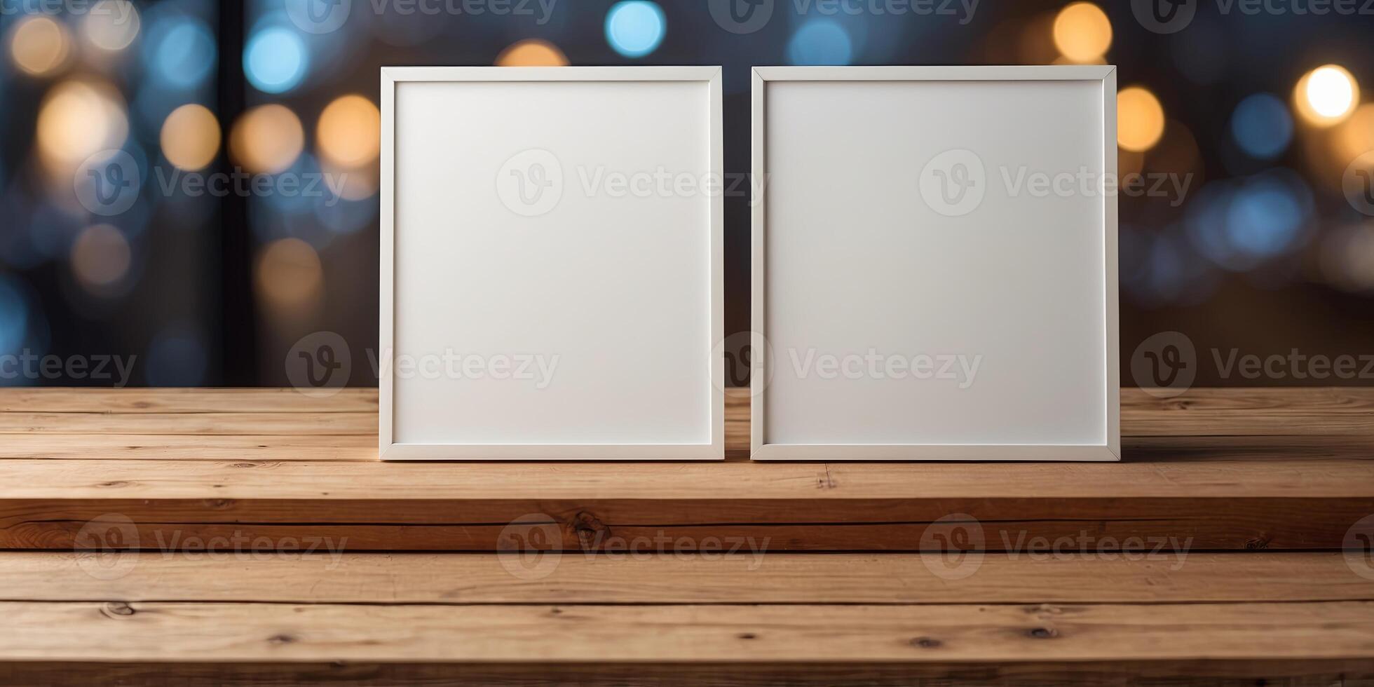 front view of two identical white blank canvas on a wooden table. photo