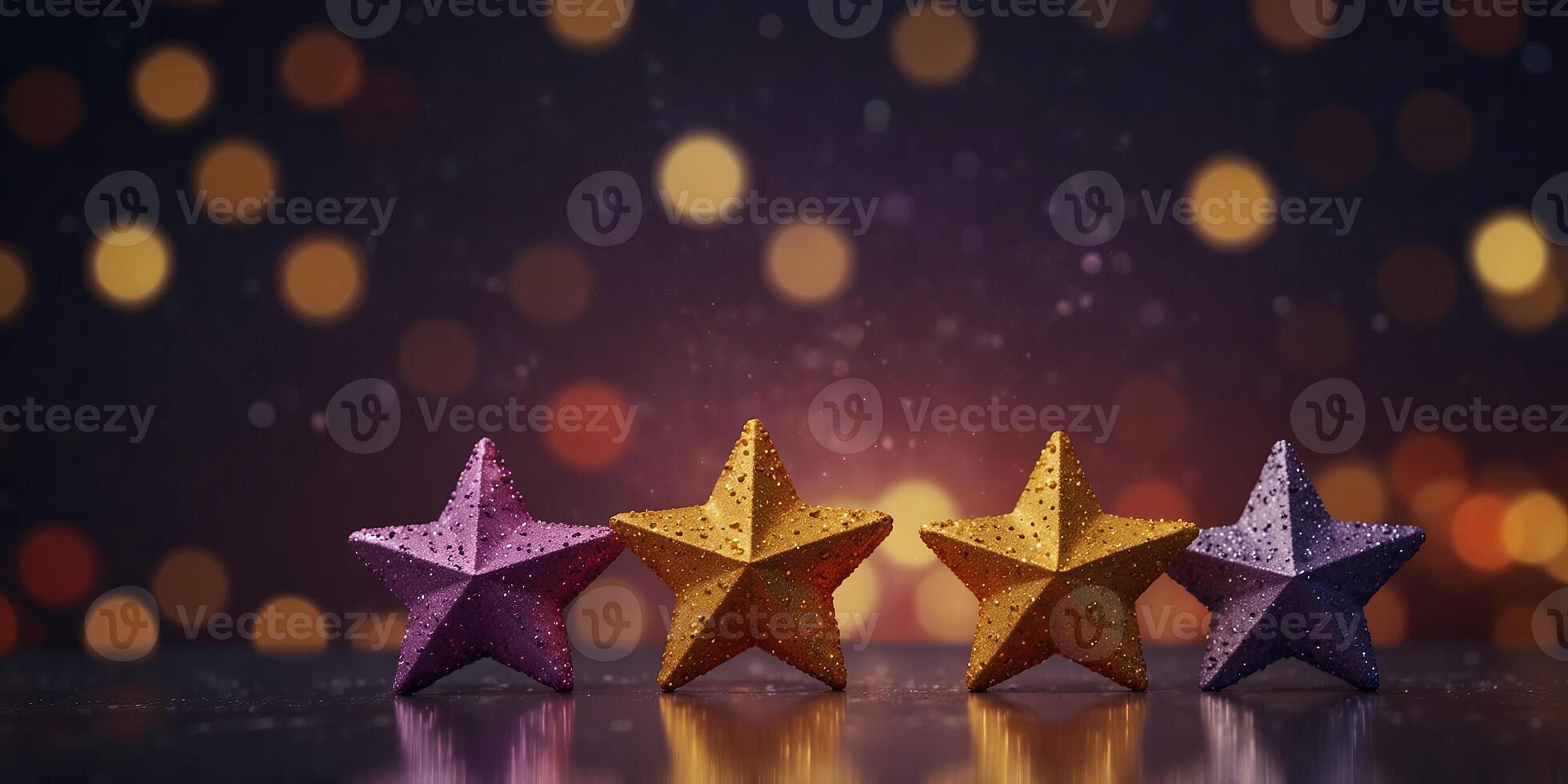 Five glittering stars in purple, red, and gold on a radiant bokeh background. photo