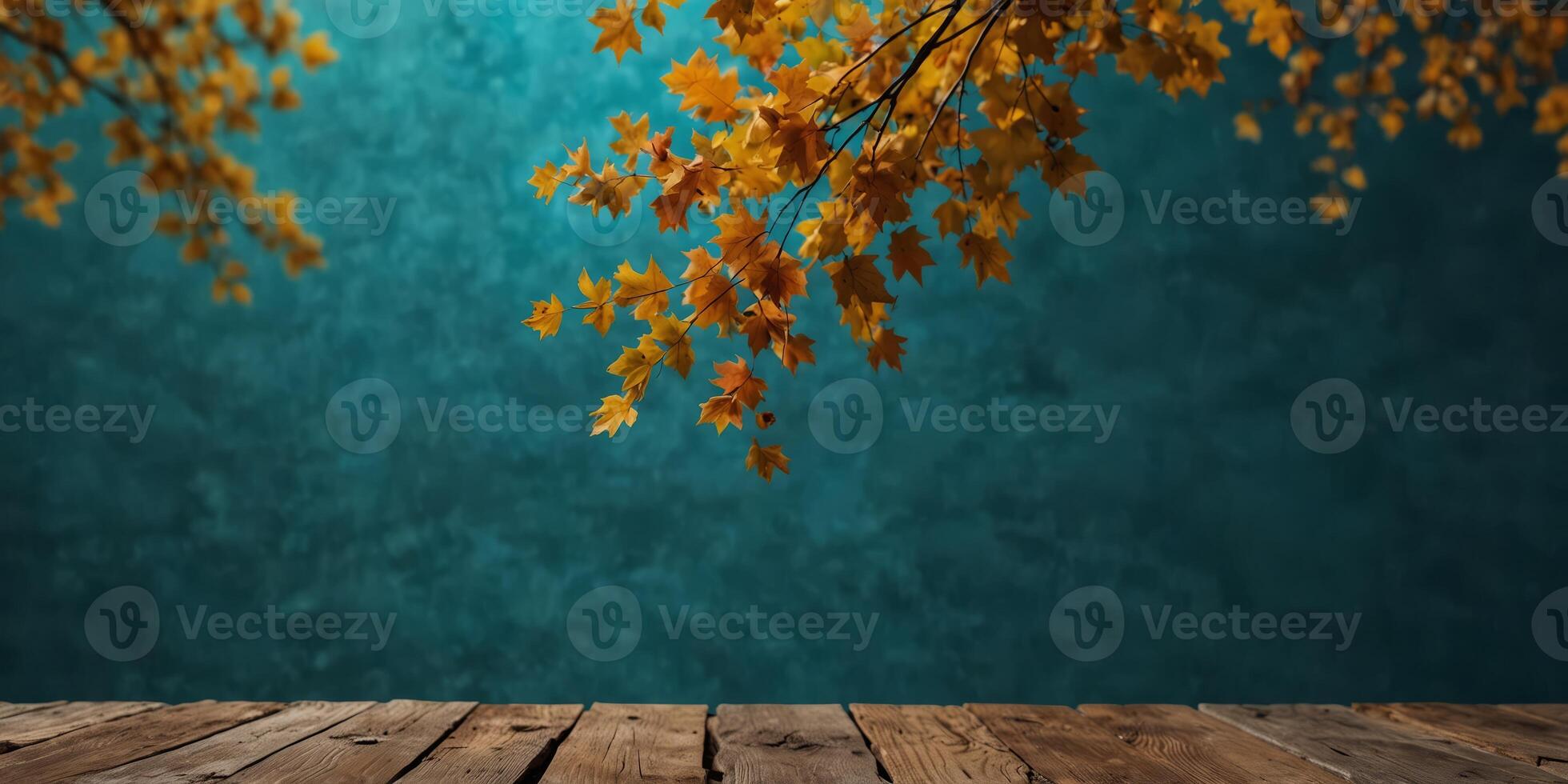 anutumn leanves over turquoise wooden banckground with empty spance. photo