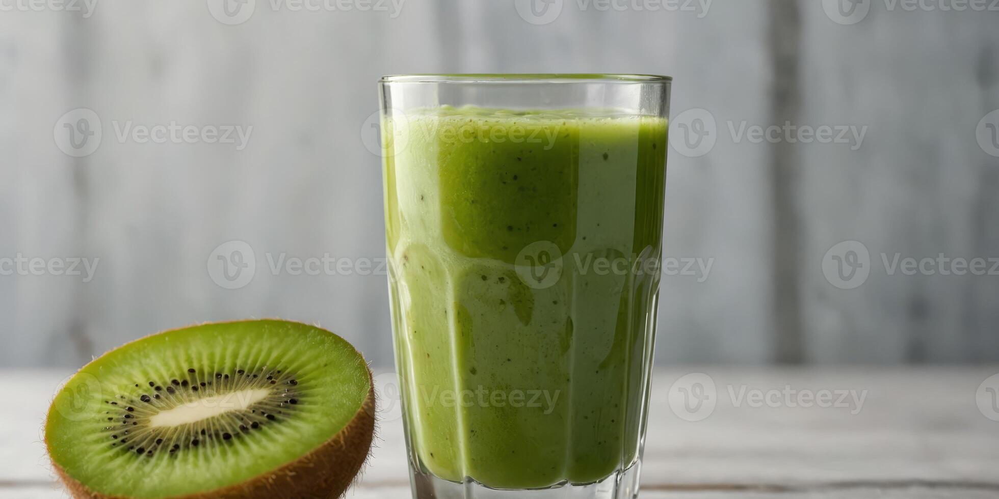 kiwi yogurt fruit juice smoothie annd green kiwi juice drink heanlthy delicious tanste in an glanss for weight loss on an white wooden banckground. photo