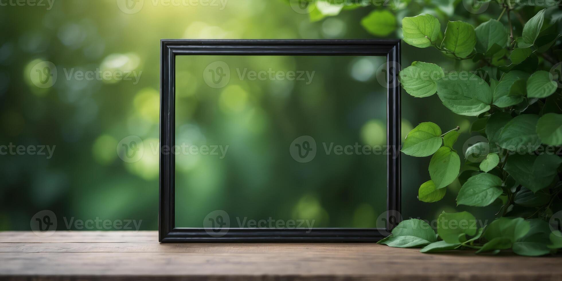 Empty Elegant Black Wooden Frame Mockup with Green Leaves Background Ideal for Stylish Wall Decor and Artwork Display, Providing Abundant Copy Space for Customization. photo