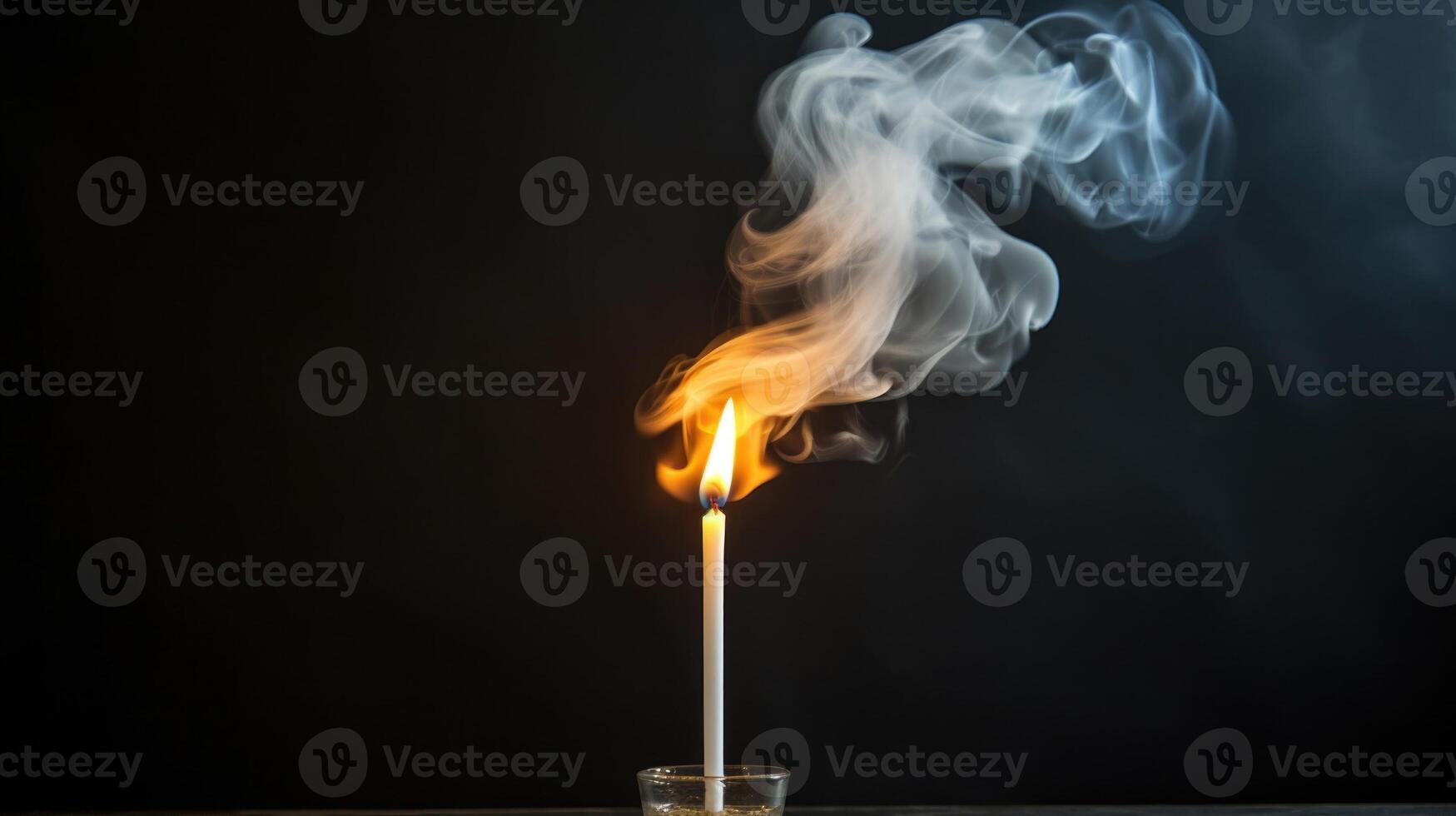 A single candle standing tall, with the smoke from its extinguished wick slowly spreading out and engulfing the frame. photo