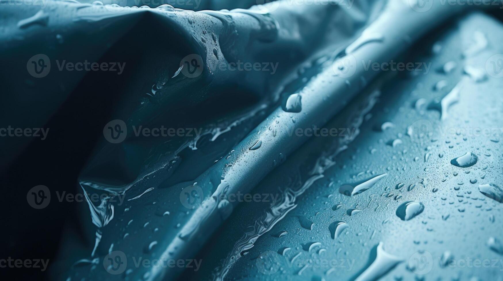 The camera follows droplets sliding off a wet hoodie, revealing the raw and natural beauty of the theme of water. photo