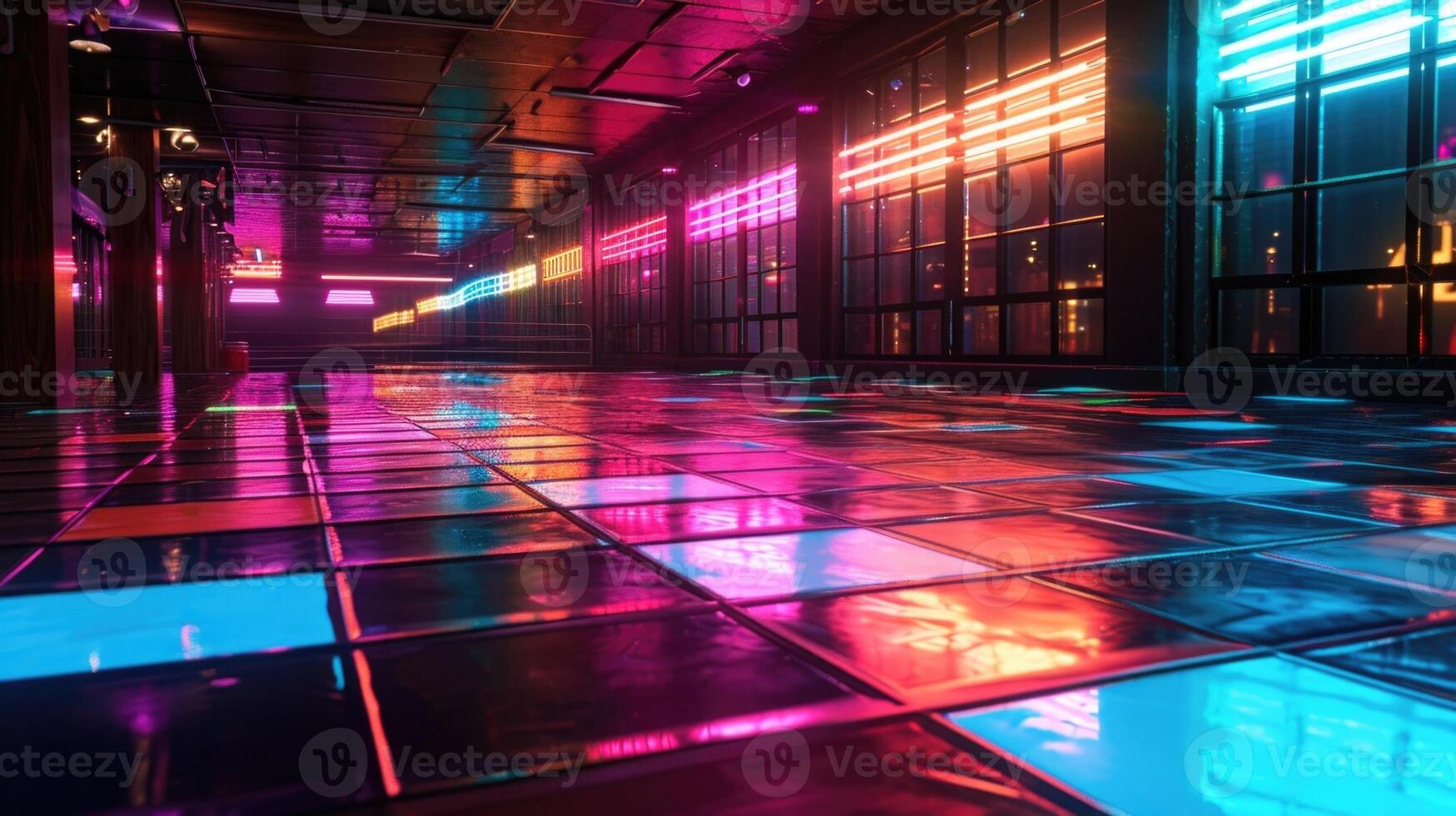 The neon lights reflect off the shiny surface of the dance floor creating a mesmerizing effect that is impossible to resist photo