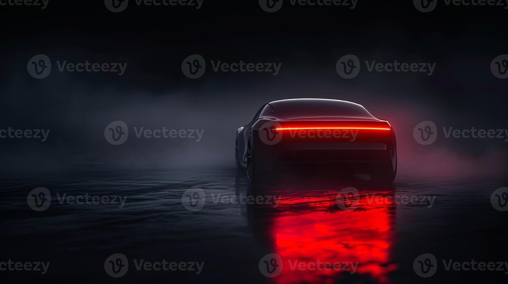 In a sea of darkness the only luminescent trail is left behind by the illuminated tail lights of a ping vehicle photo