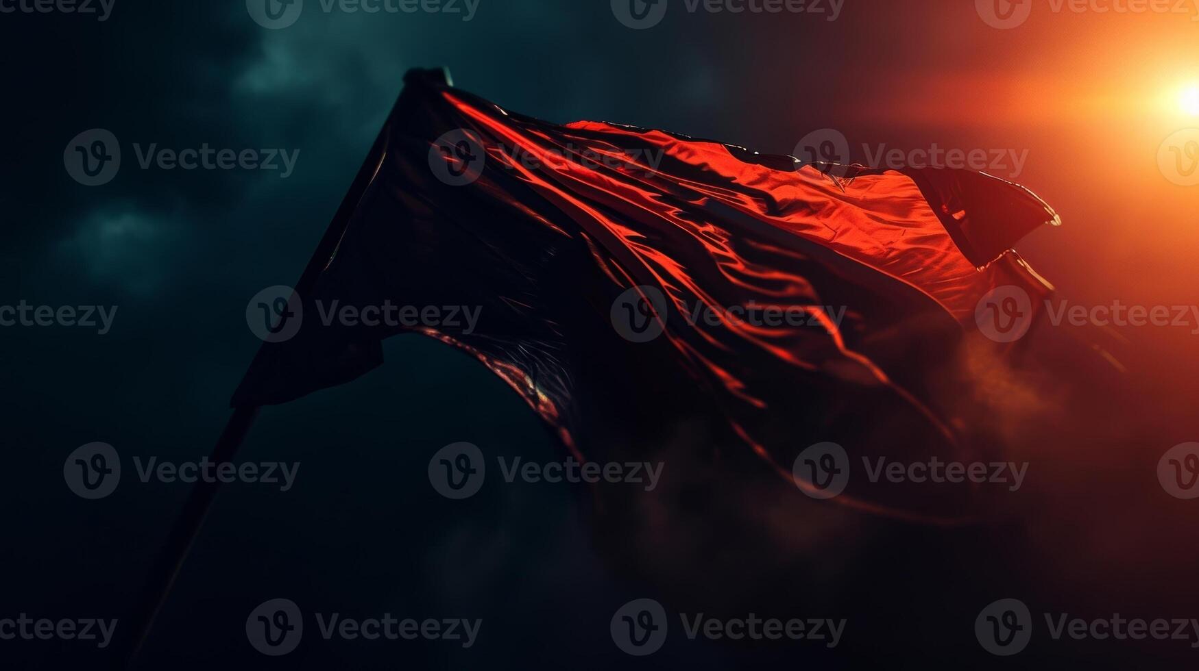 Closeup of the flag being held up against the dark night sky creating a striking contrast between light and dark photo