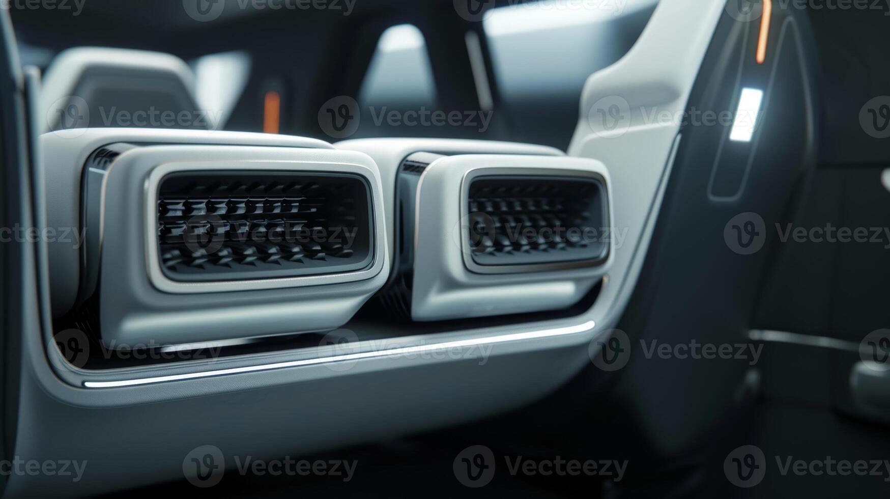 Detailed shot of the backseat air vents highlighting their dual function of providing both heating and cooling for pengers in the rear photo