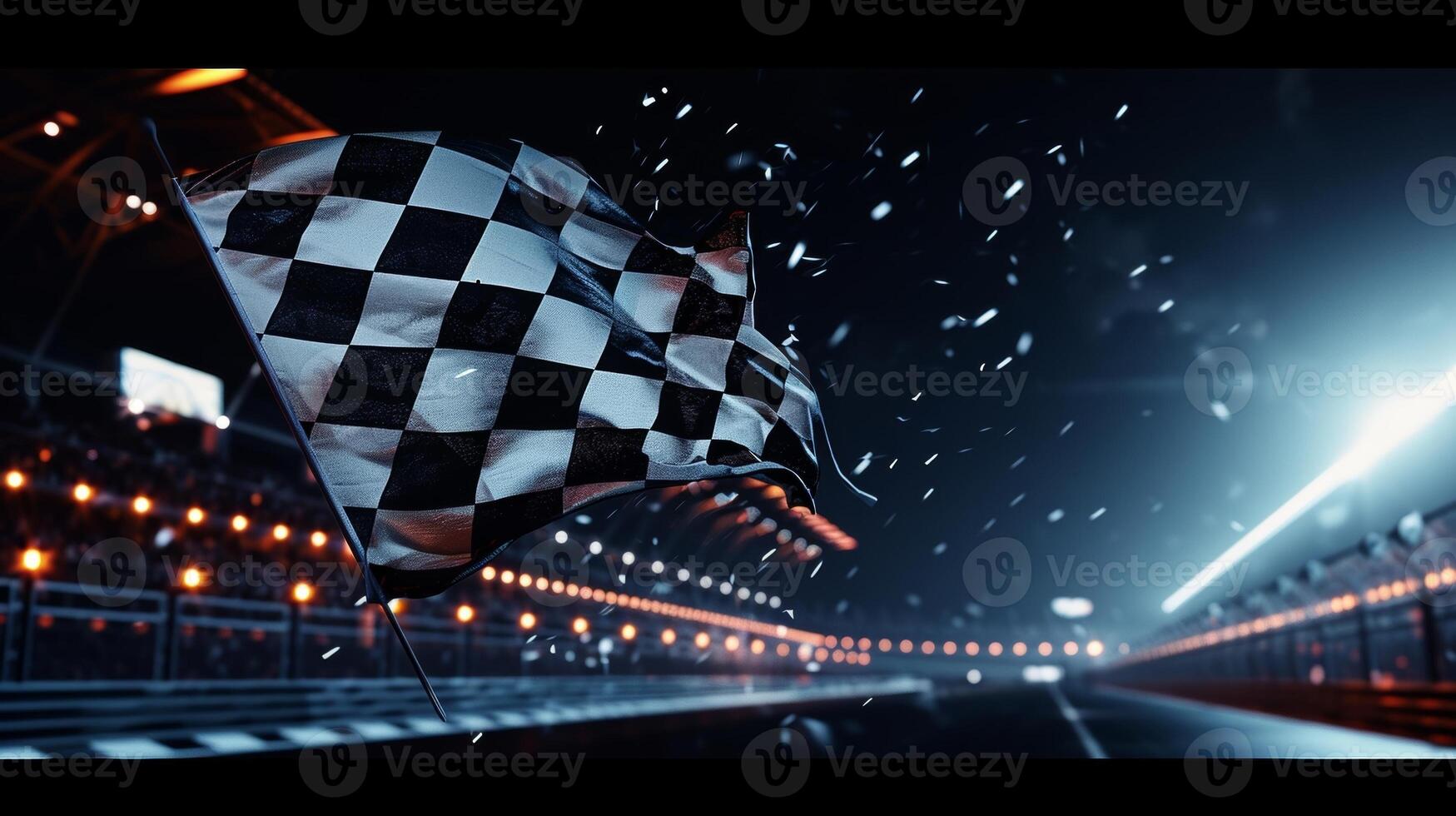 The checkered flag adorned with white and black squares flapping in the wind as it is celebrated under the glowing stadium lights photo