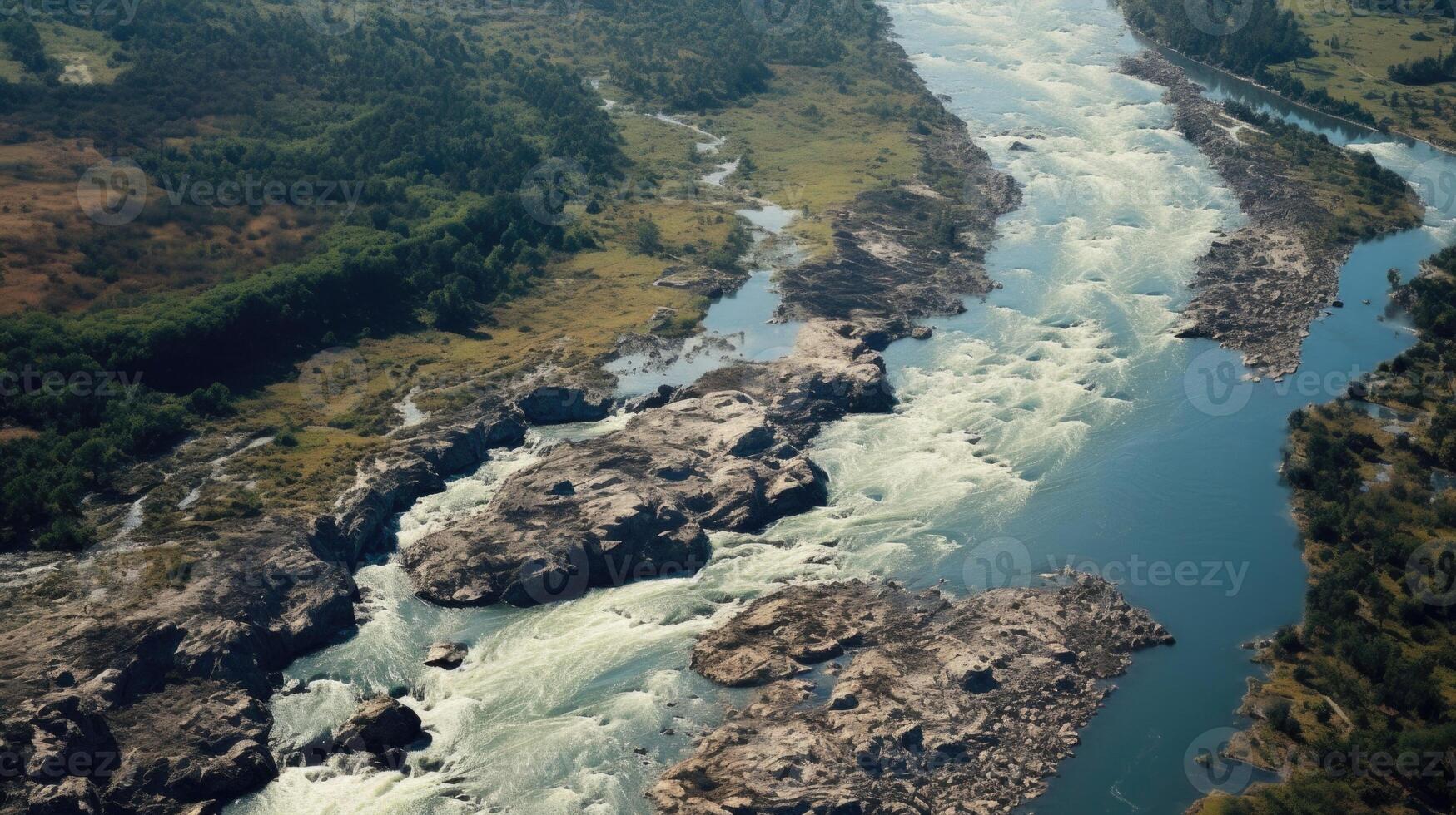A dramatic aerial view of a powerful river breaking its banks, sweeping away everything in its path. photo