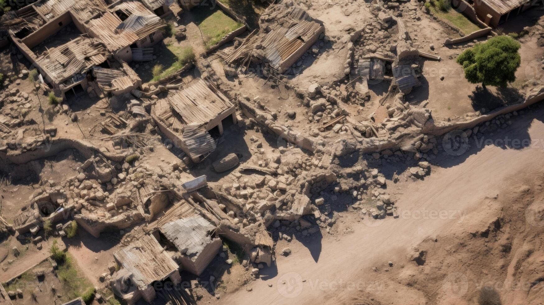 An overhead view of a community in ruins, with cracked ground and fault lines spreading like a spider web, a grim reminder of the intense tremors that shook the region. photo