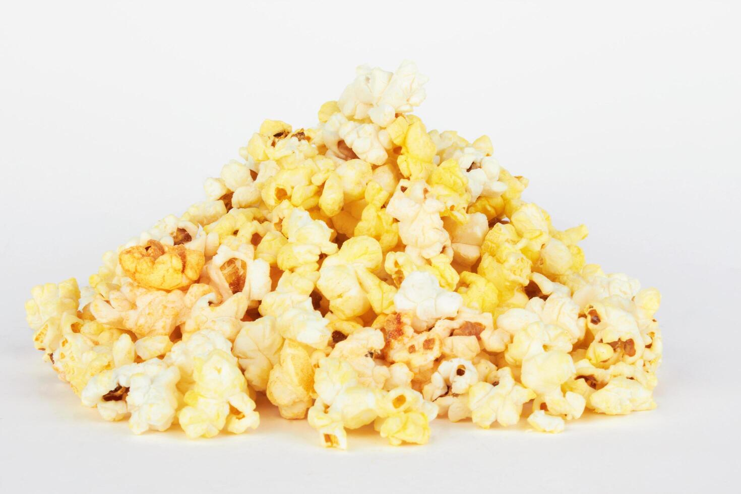Salted popcorn on white photo