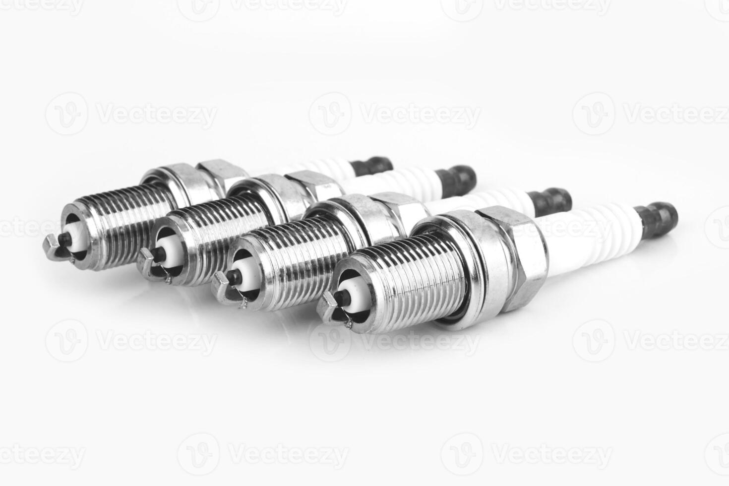 spark plugs on white photo