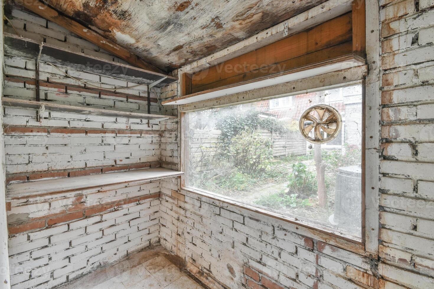 A room with a window and a shelf in it photo