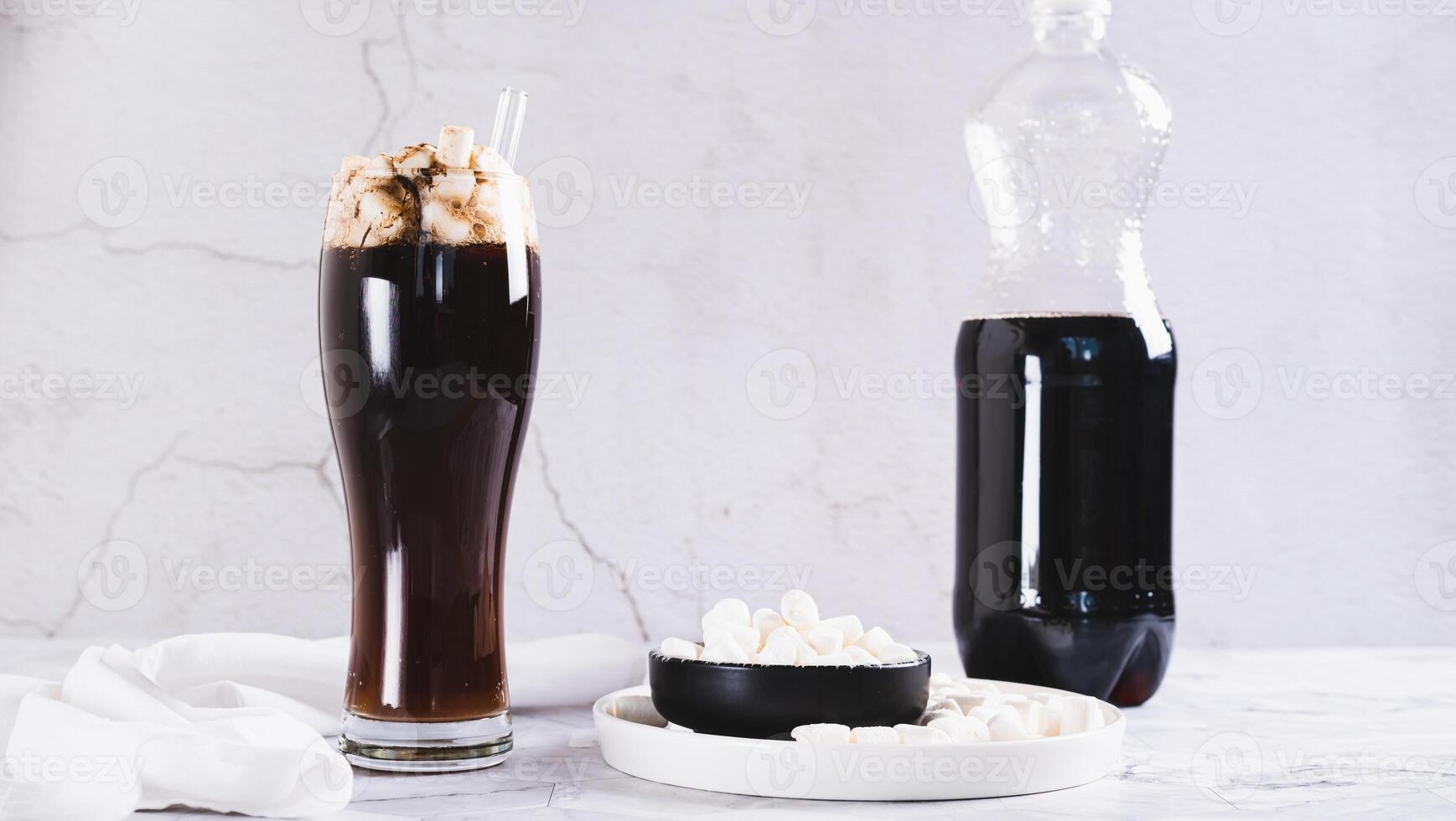 Trendy drink of cola and marshmallow in a glass on the table web banner photo