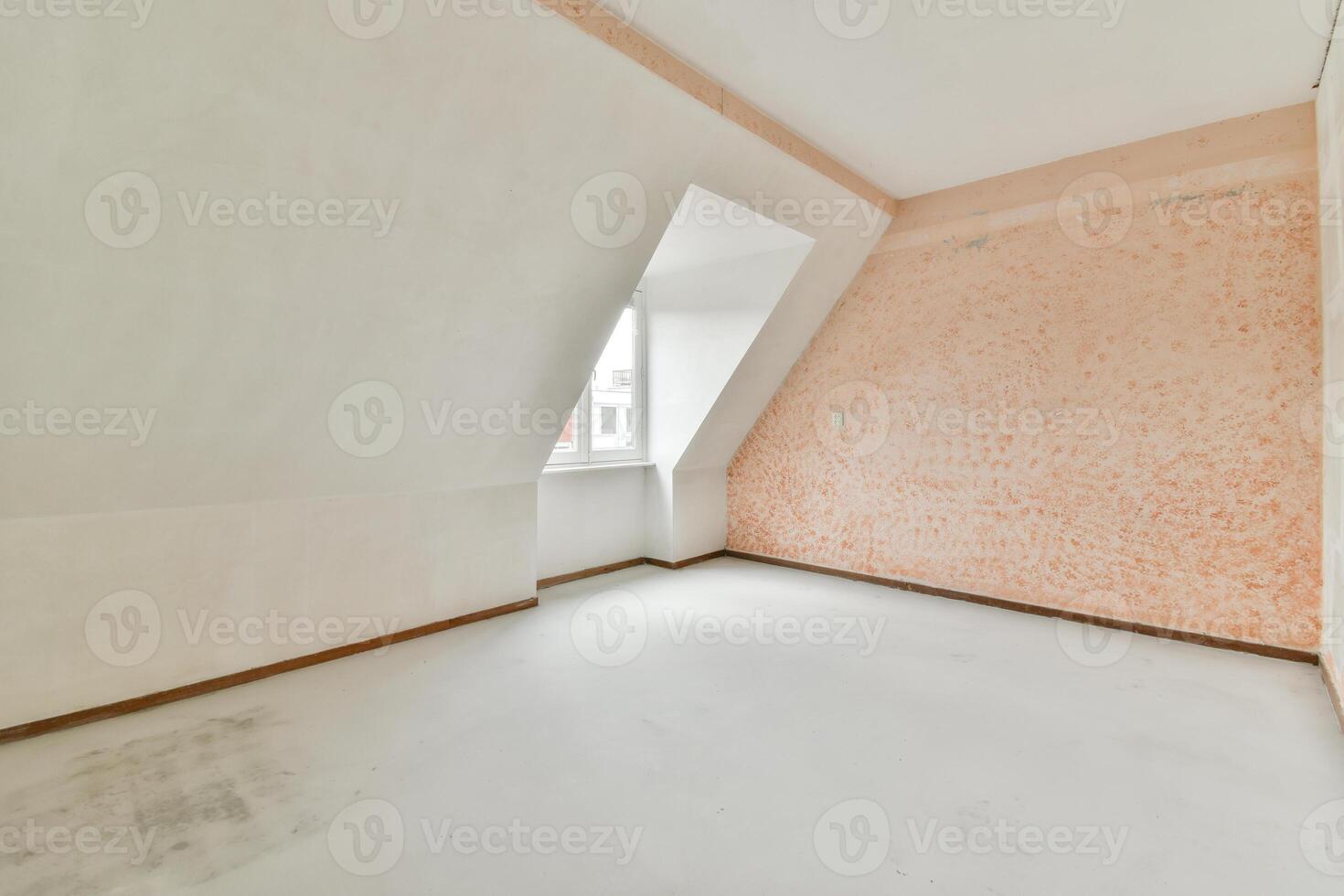 An empty room with a white ceiling and orange walls photo