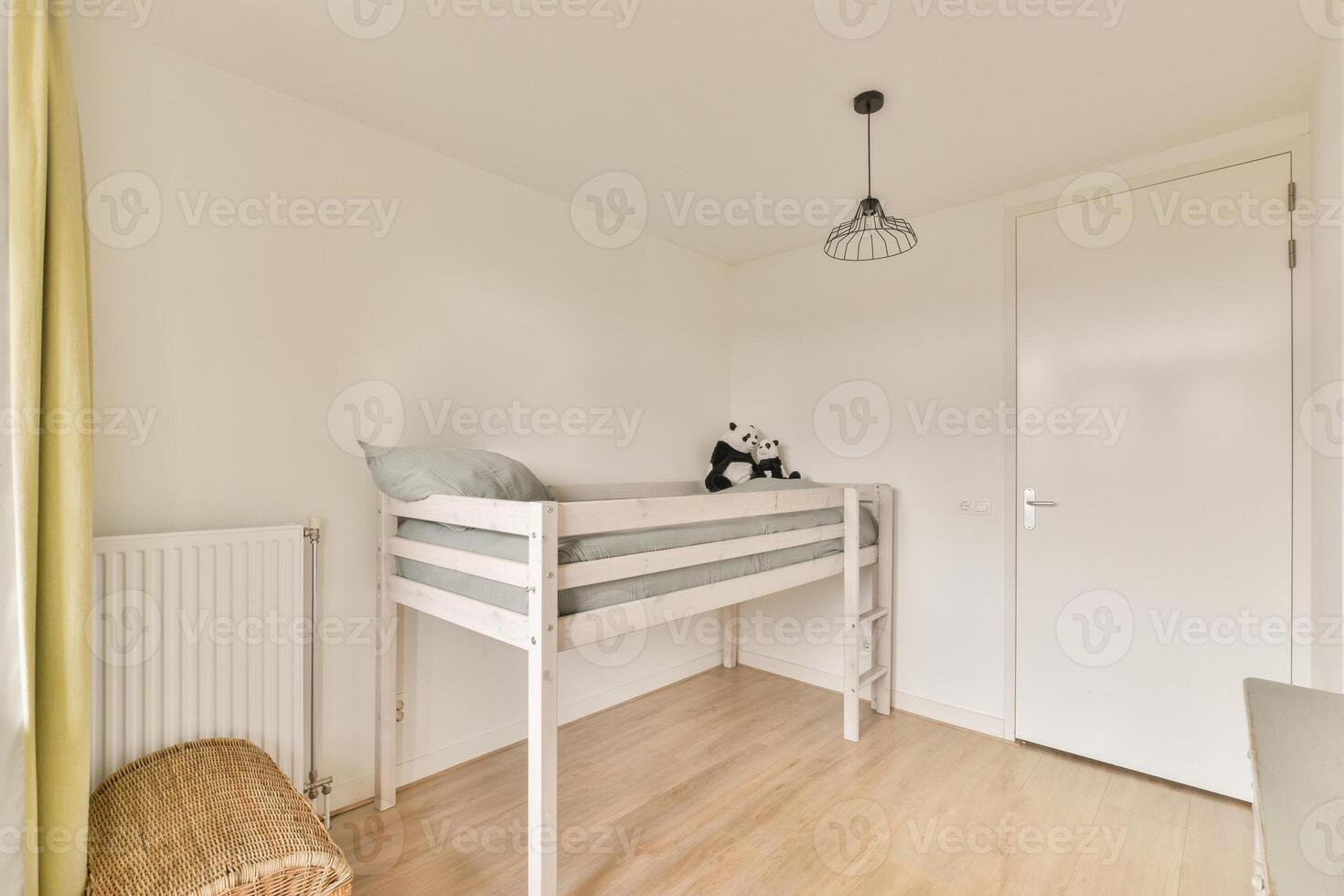 A small bedroom with a bunk bed and a white wall photo
