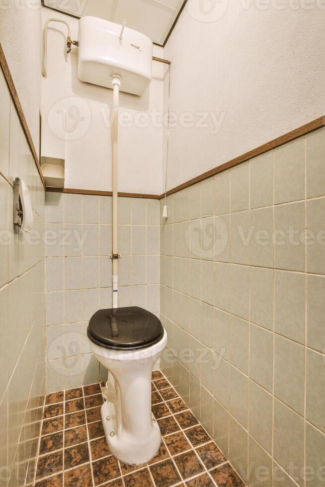 A toilet in a bathroom photo